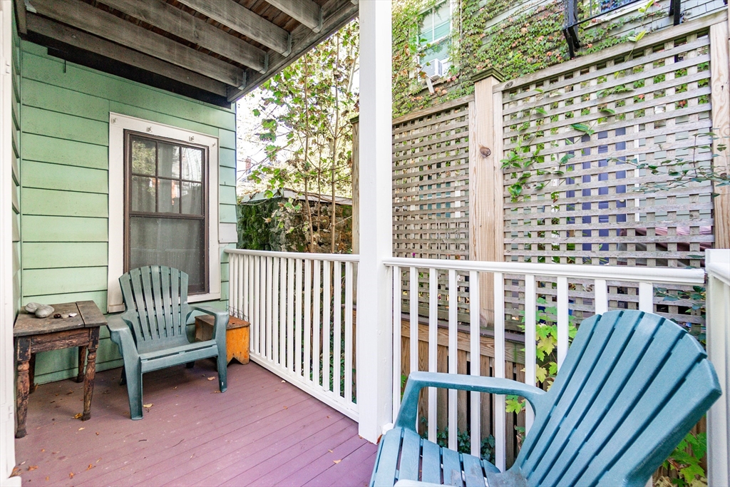 25 Eustis Street, Unit 1 Cambridge, MA 02140 - Photo 13 of 14 a view of a porch with a bench