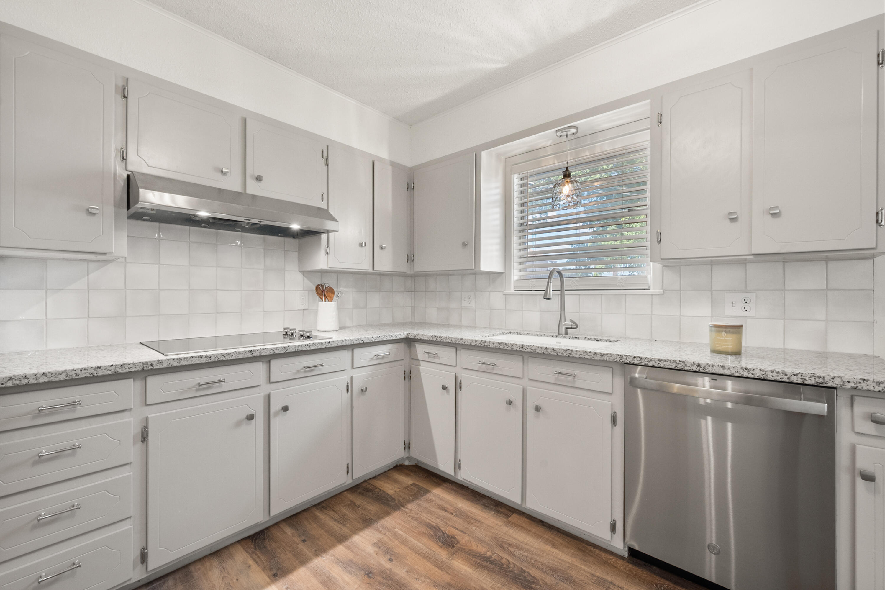 816 Cedar Street Floydada, TX 79235 - Photo 11 of 24 a kitchen with sink cabinets and window
