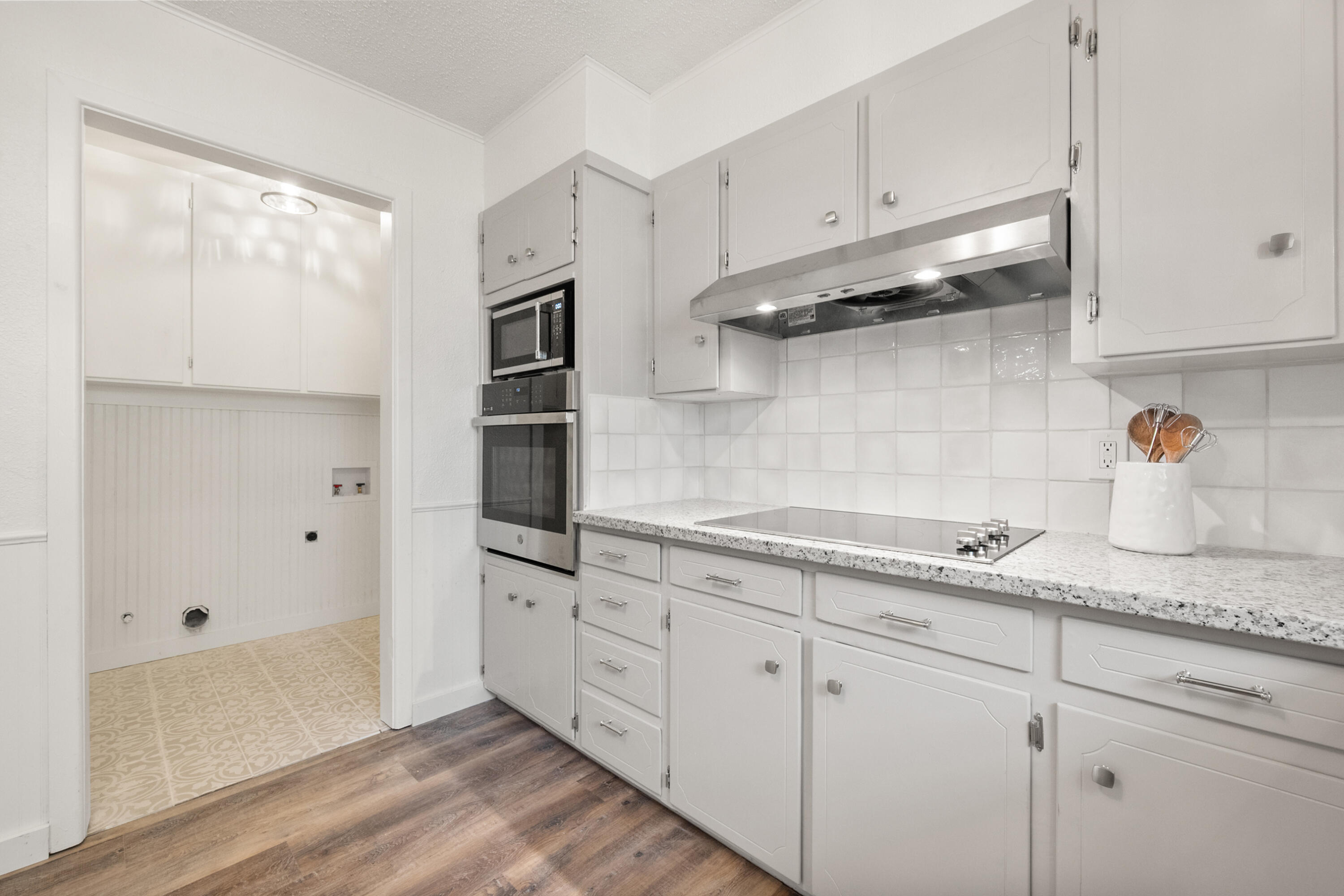 816 Cedar Street Floydada, TX 79235 - Photo 12 of 24 a kitchen with stainless steel appliances white cabinets and a sink