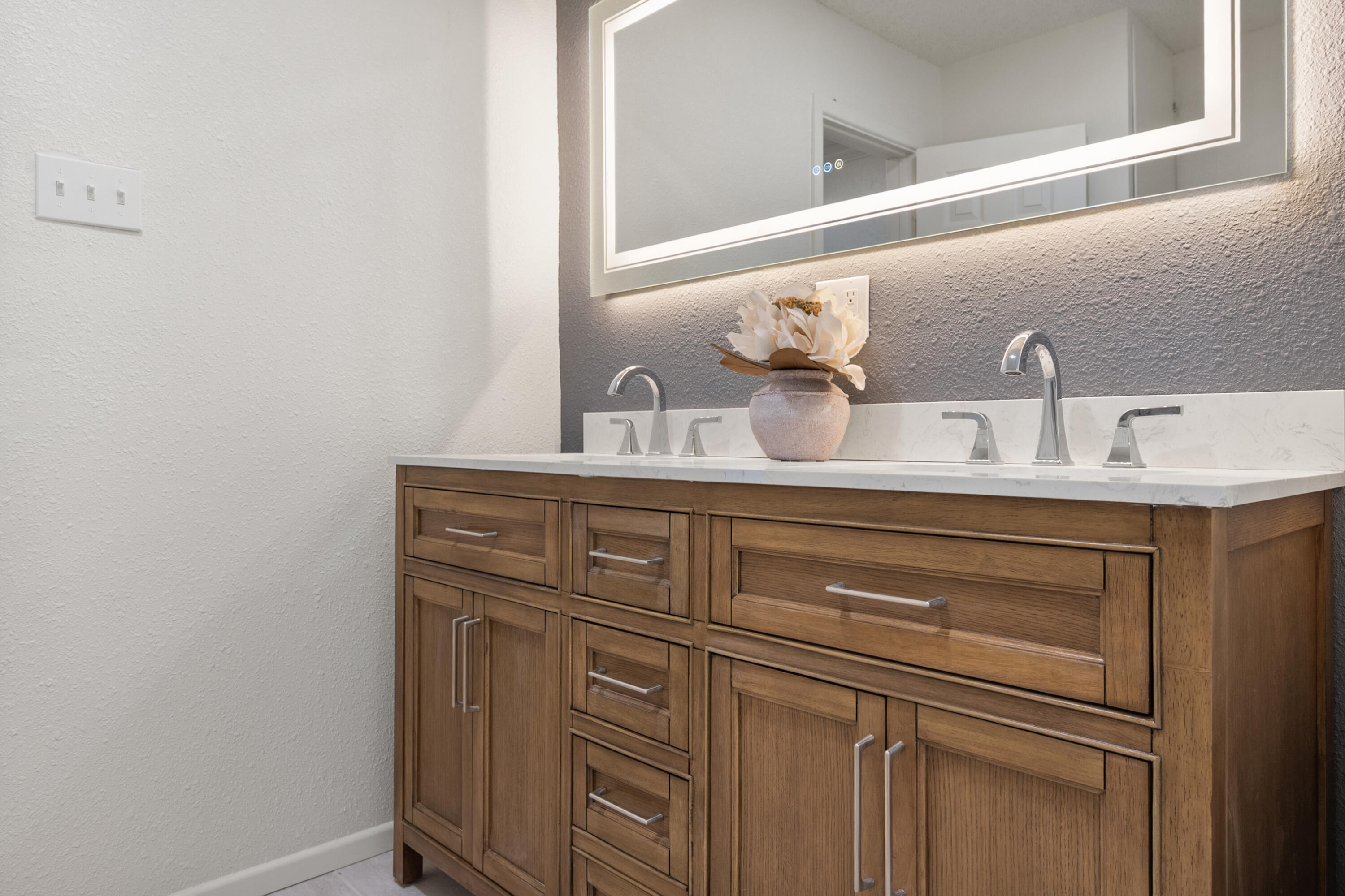 816 Cedar Street Floydada, TX 79235 - Photo 16 of 24 a bathroom with a sink and a mirror