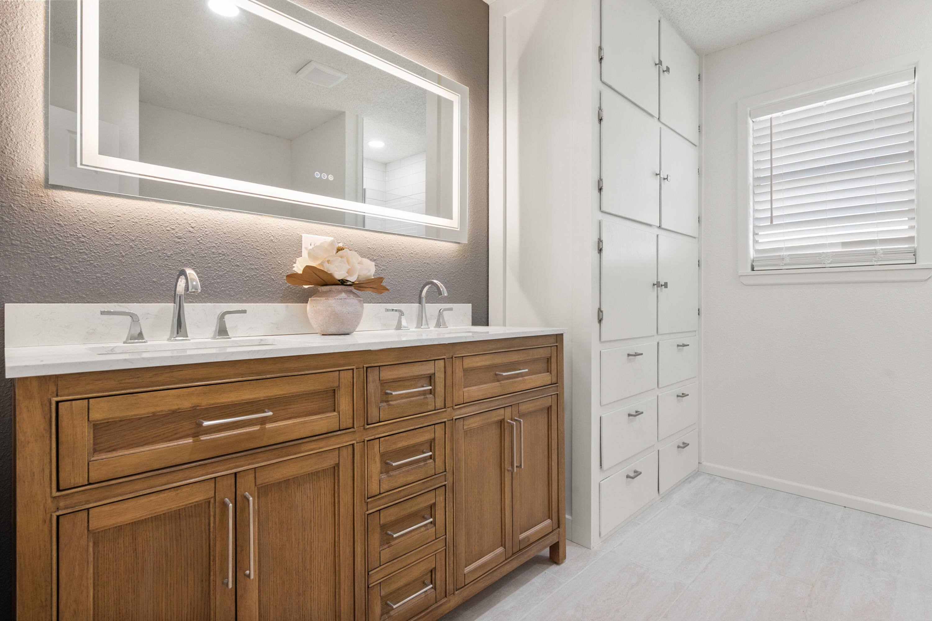816 Cedar Street Floydada, TX 79235 - Photo 17 of 24 a bathroom with a sink and a mirror