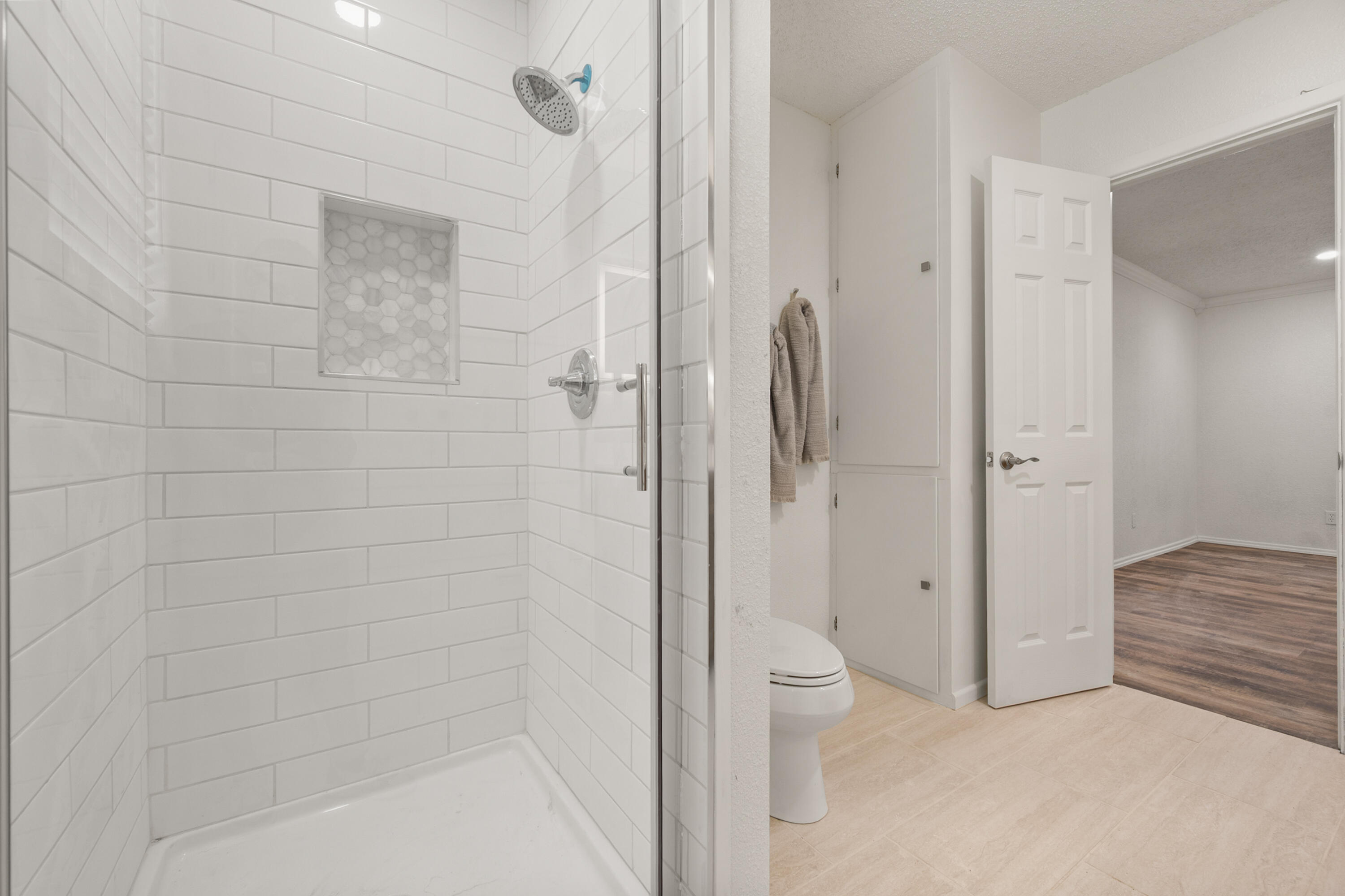 816 Cedar Street Floydada, TX 79235 - Photo 18 of 24 a bathroom with a shower and a toilet