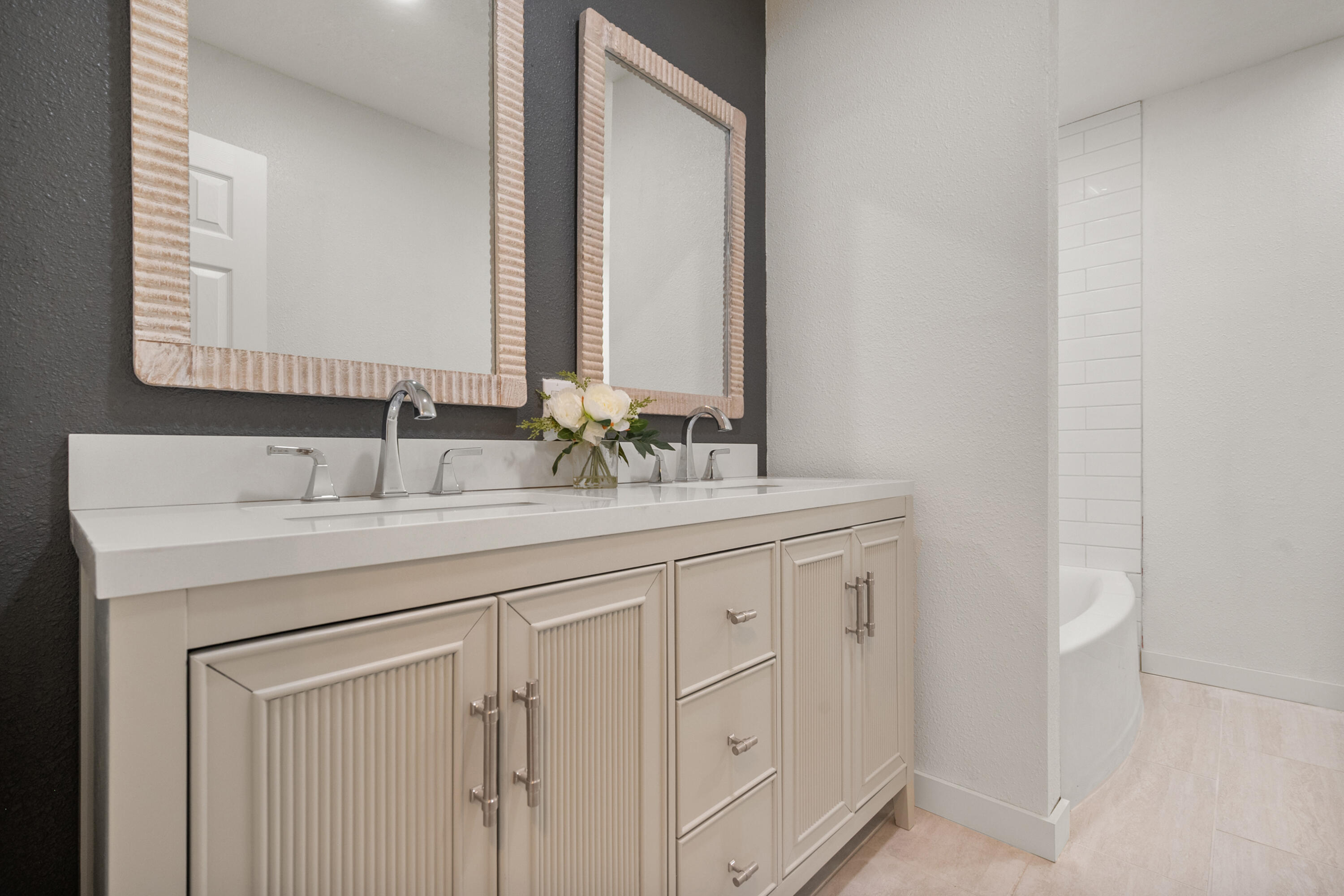 816 Cedar Street Floydada, TX 79235 - Photo 21 of 24 a bathroom with a double vanity sink and a mirror