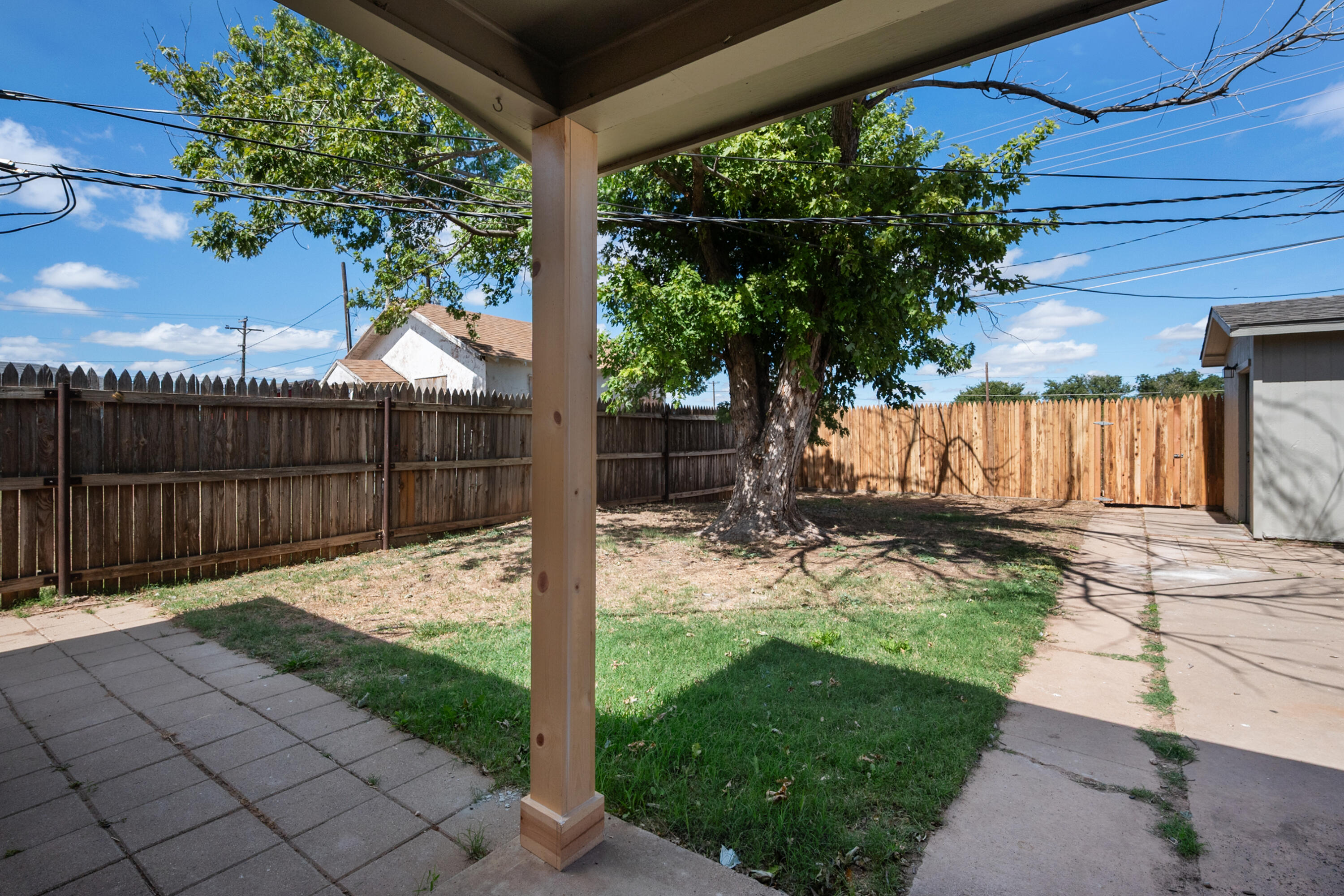 816 Cedar Street Floydada, TX 79235 - Photo 23 of 24 a view of a backyard with wooden fence