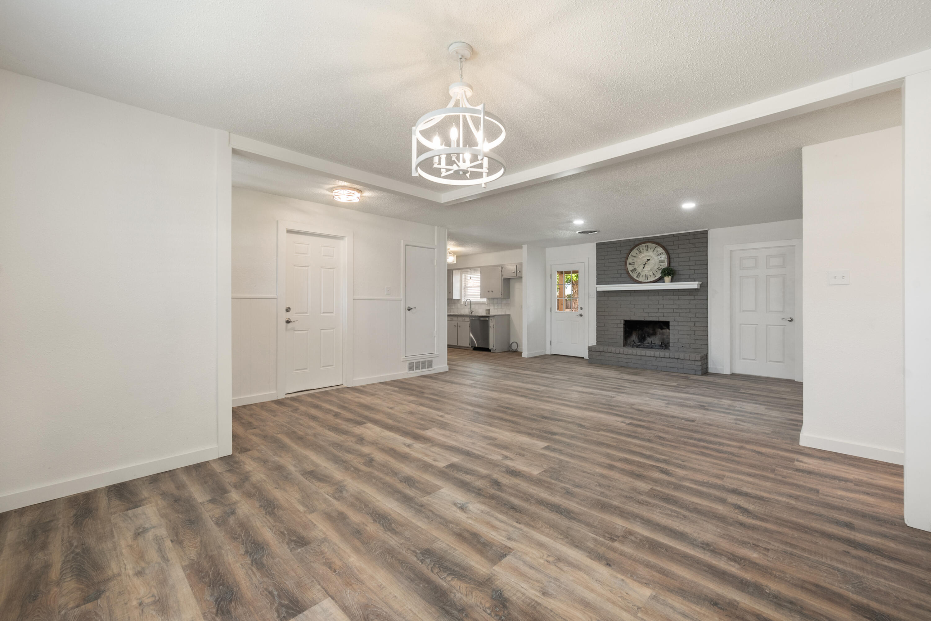 816 Cedar Street Floydada, TX 79235 - Photo 8 of 24 a view of an empty room with fire place and a window