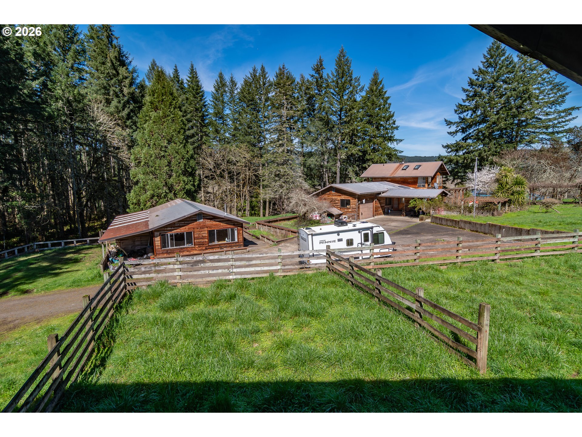 4890 Henderer Road Elkton, OR 97436 - Photo 1 of 48 a view of a house with a yard
