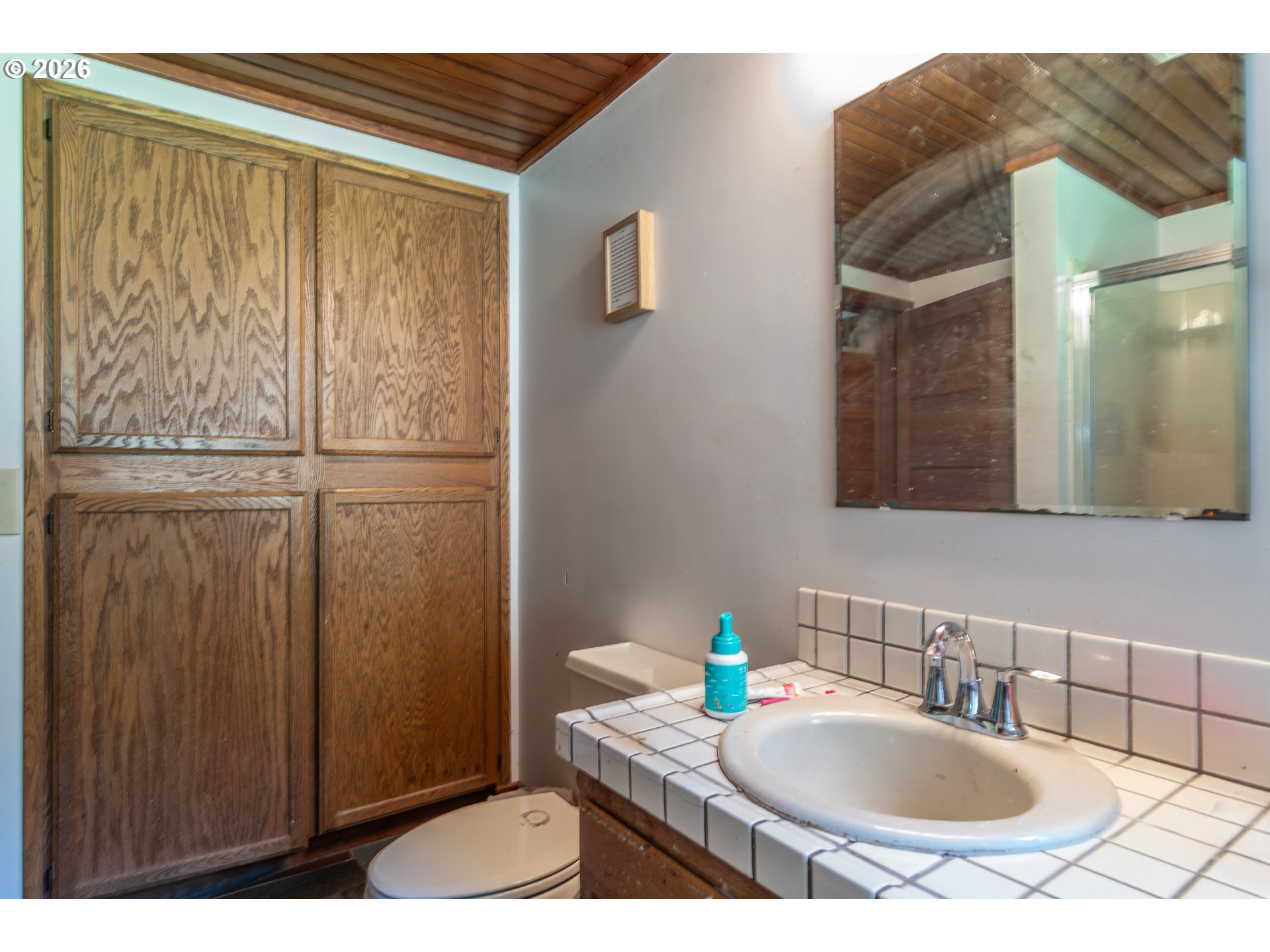 4890 Henderer Road Elkton, OR 97436 - Photo 11 of 48 a bathroom with a sink and a mirror