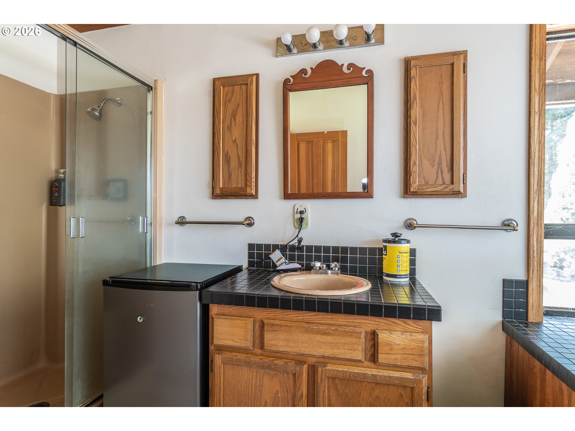 4890 Henderer Road Elkton, OR 97436 - Photo 15 of 48 a bathroom with a sink and a mirror