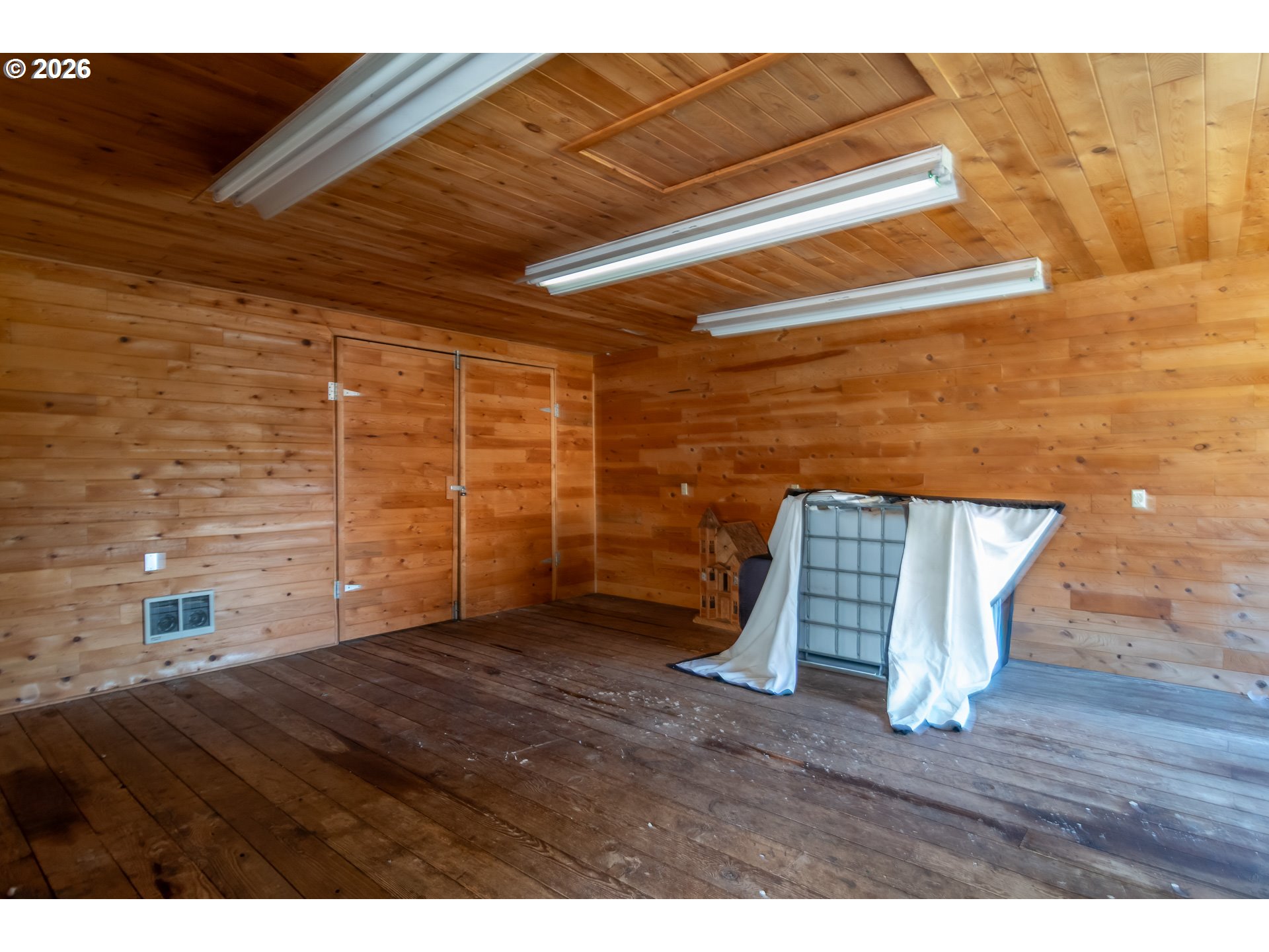 4890 Henderer Road Elkton, OR 97436 - Photo 29 of 48 a view of empty room with wooden floor
