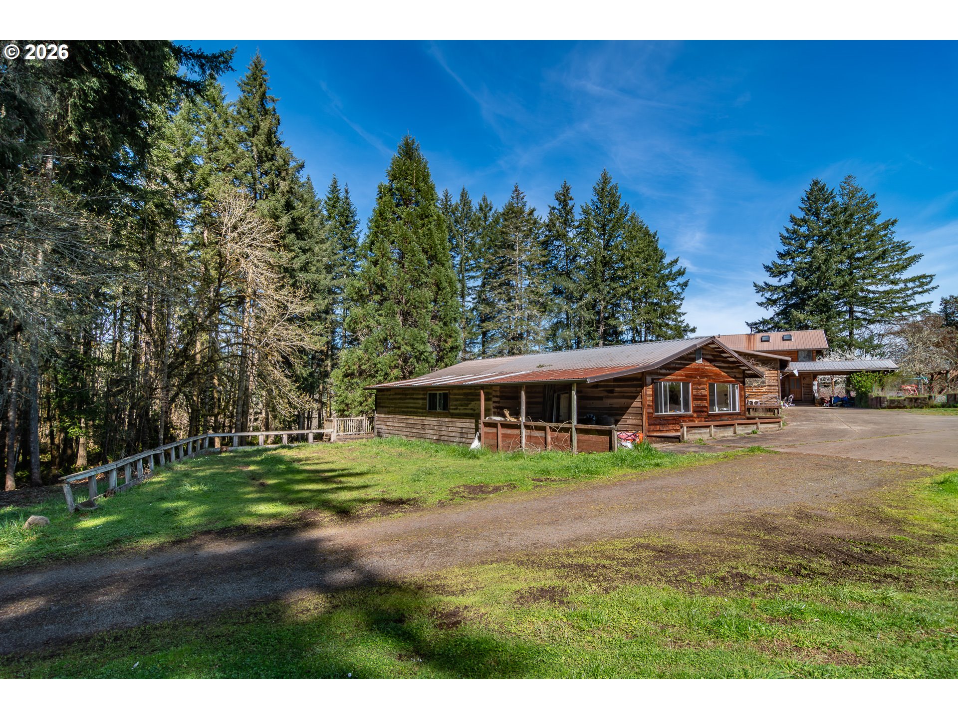 4890 Henderer Road Elkton, OR 97436 - Photo 33 of 48 a view of house with outdoor space and garden