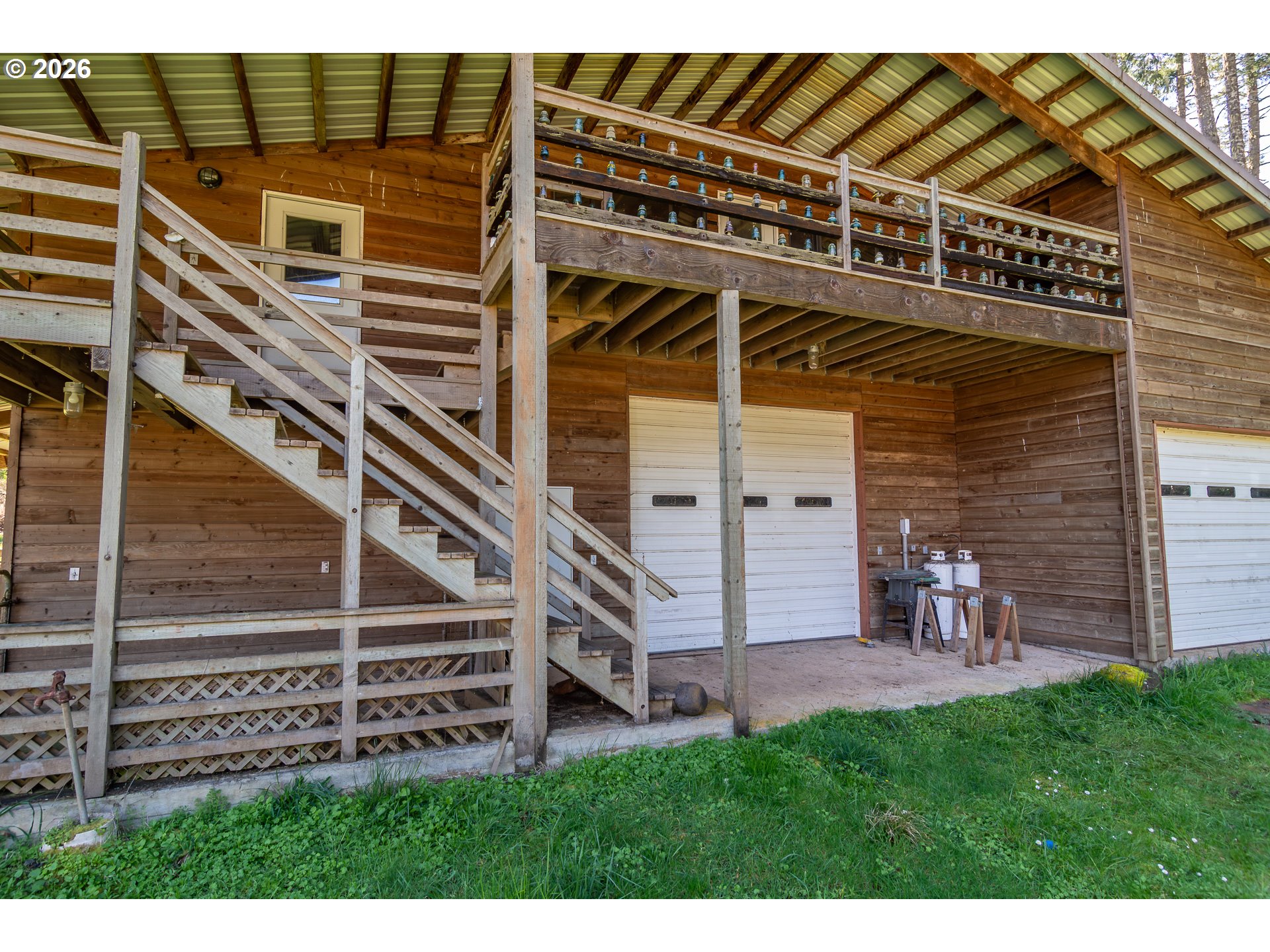4890 Henderer Road Elkton, OR 97436 - Photo 37 of 48 a view of a house with a yard and stairs