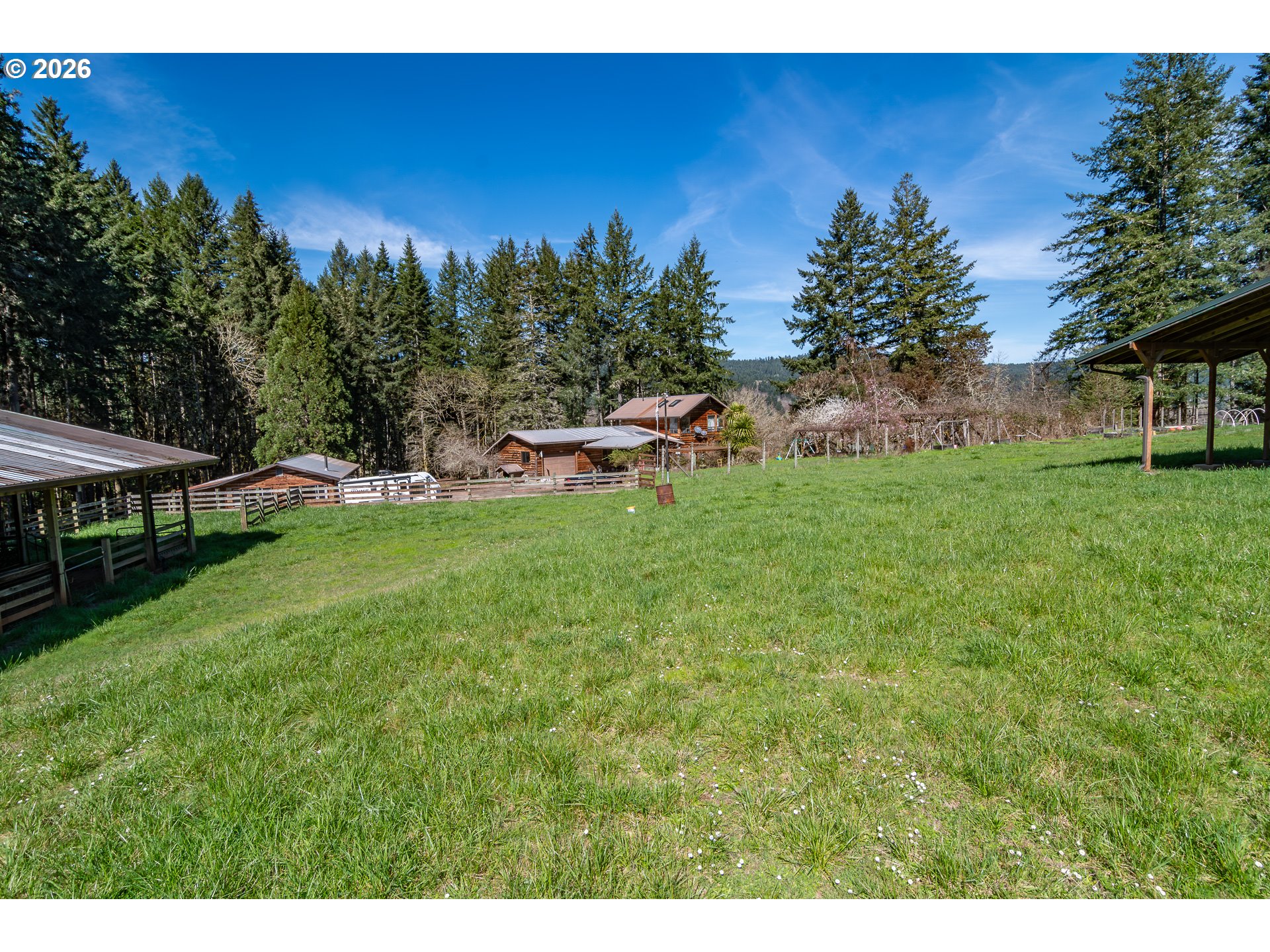 4890 Henderer Road Elkton, OR 97436 - Photo 42 of 48 a view of a backyard with a garden