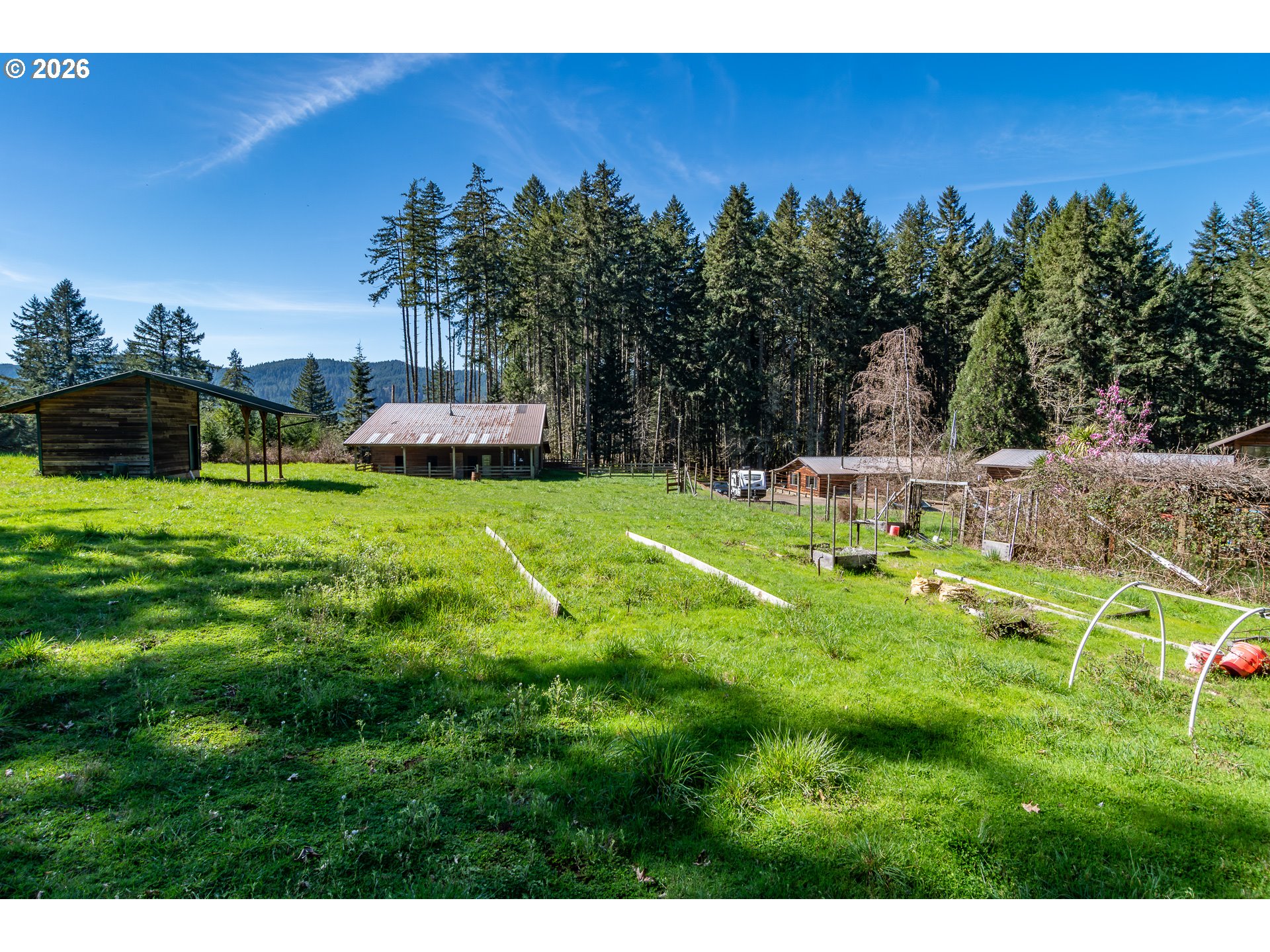 4890 Henderer Road Elkton, OR 97436 - Photo 43 of 48 a view of a house with a yard