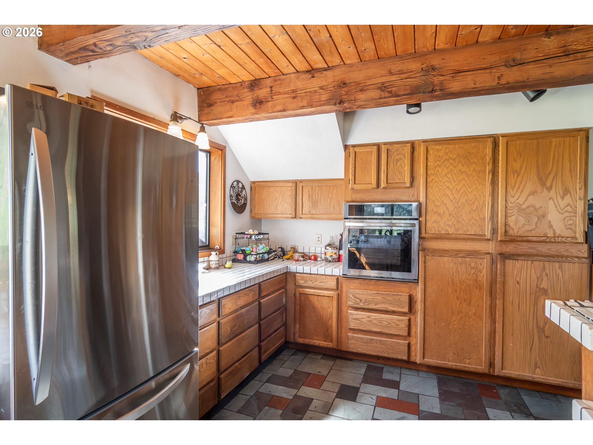 4890 Henderer Road Elkton, OR 97436 - Photo 5 of 48 a kitchen with stainless steel appliances granite countertop a refrigerator and a sink
