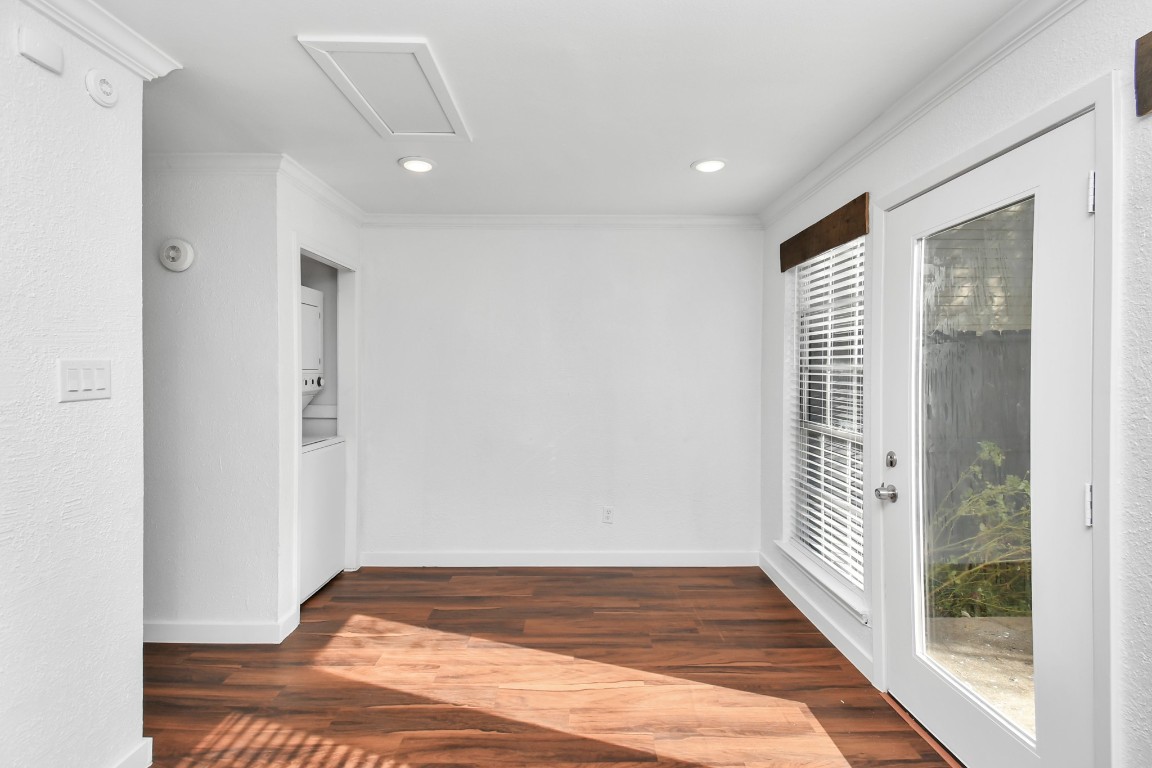 2002 Gentryside Drive, Unit 113 Houston, TX 77077 - Photo 12 of 36 a view of a hallway with wooden floor and a bathroom