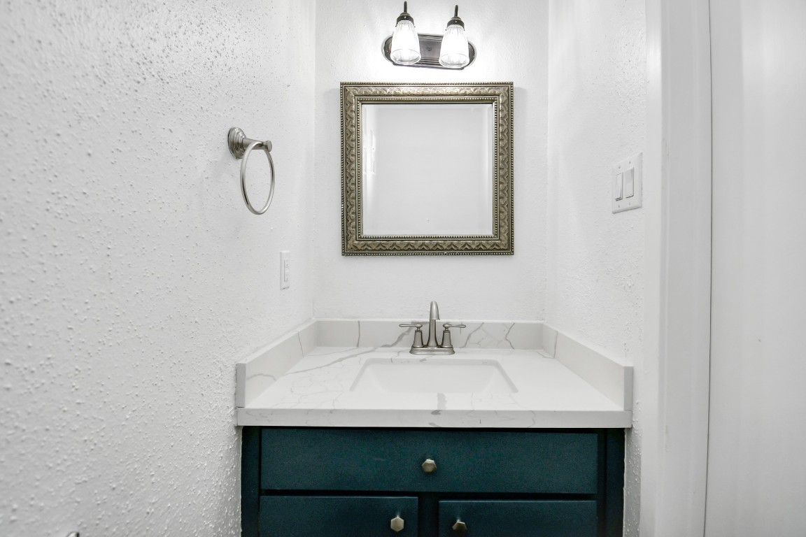 2002 Gentryside Drive, Unit 113 Houston, TX 77077 - Photo 13 of 36 a bathroom with a sink and a mirror