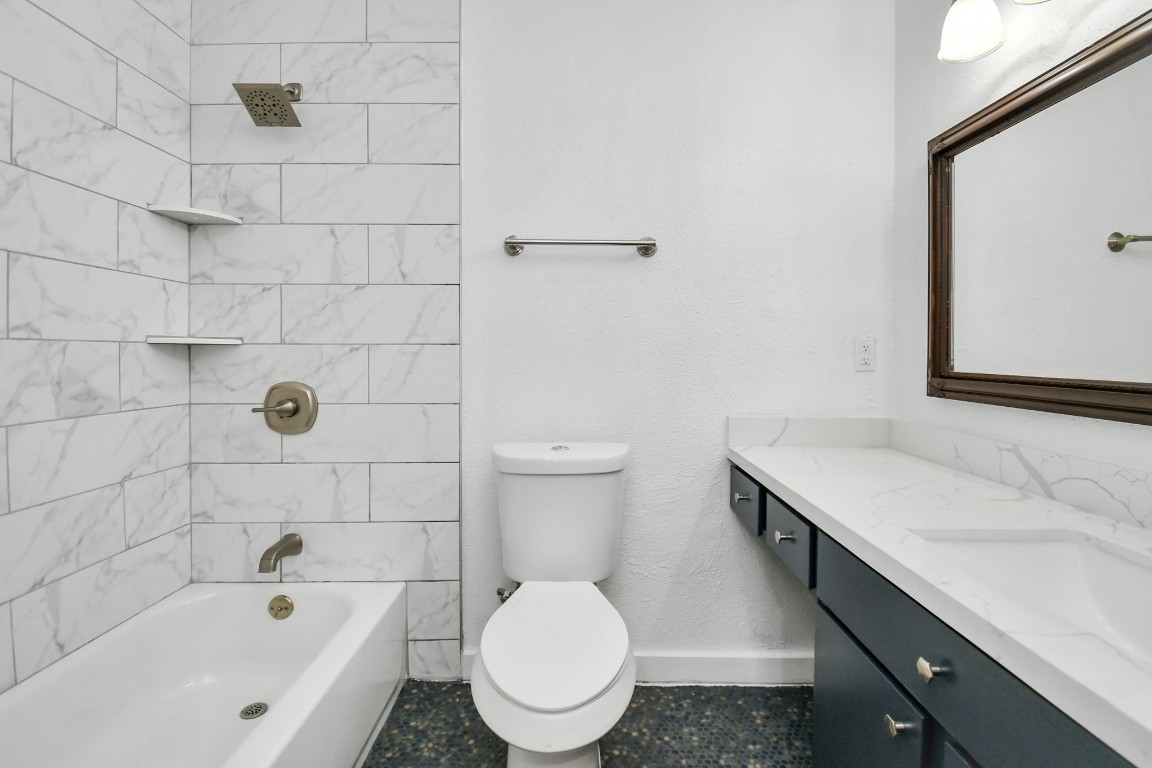 2002 Gentryside Drive, Unit 113 Houston, TX 77077 - Photo 18 of 36 a bathroom with a sink toilet and shower