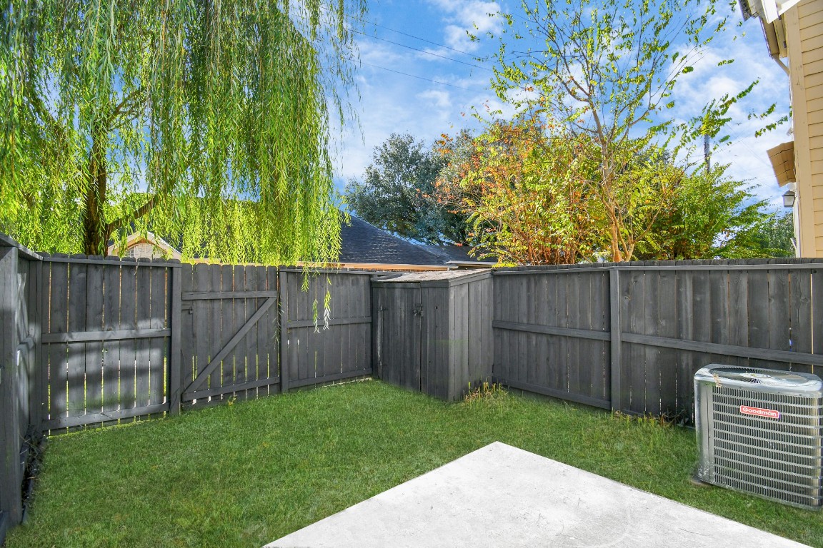 2002 Gentryside Drive, Unit 113 Houston, TX 77077 - Photo 30 of 36 a view of a backyard with wooden fence
