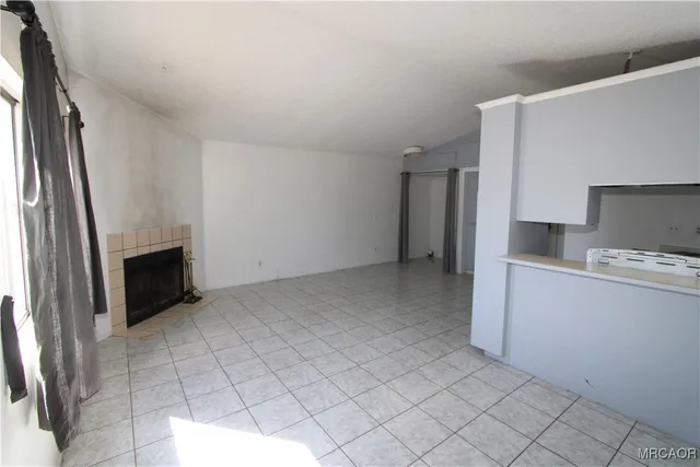 a view of a kitchen with microwave and cabinets