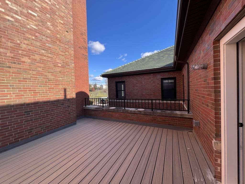160 Seabury Street, Unit 12 Fall River, MA 02720 - Photo 4 of 11 a view of a balcony with wooden floor