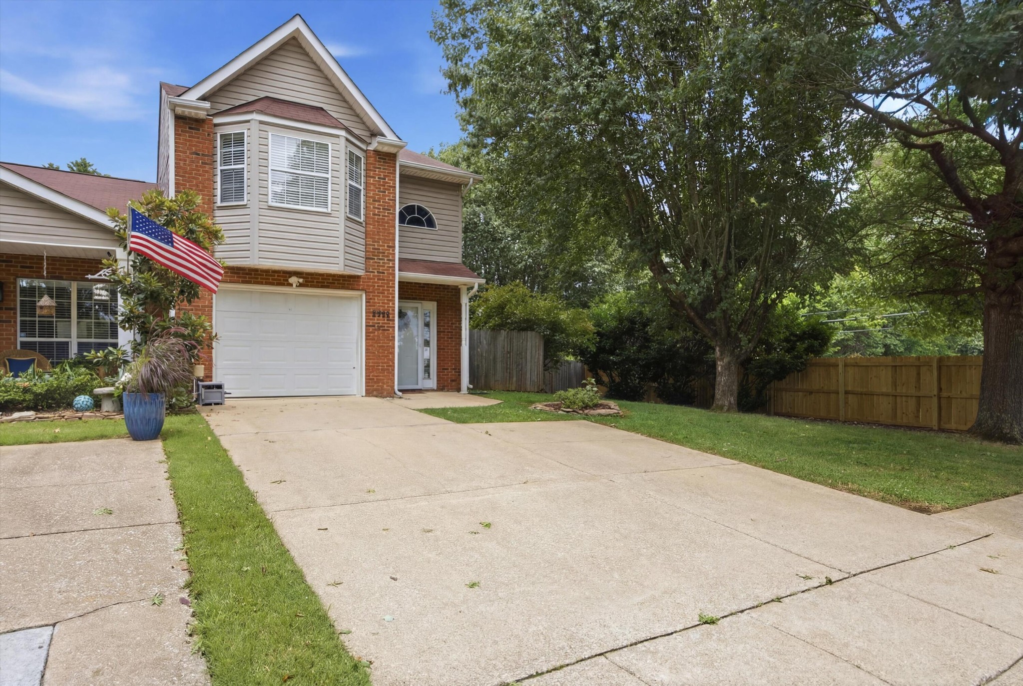 6729 Hickory Trace Circle Chattanooga, TN 37421 - Photo 2 of 30 a front view of a house with a yard and garage