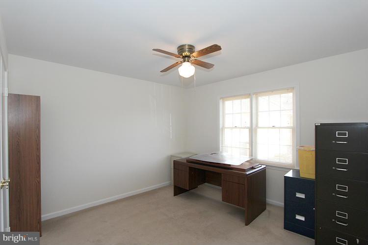 10922 Brewer House Road Rockville, MD 20852 - Photo 16 of 27 a room with furniture and window