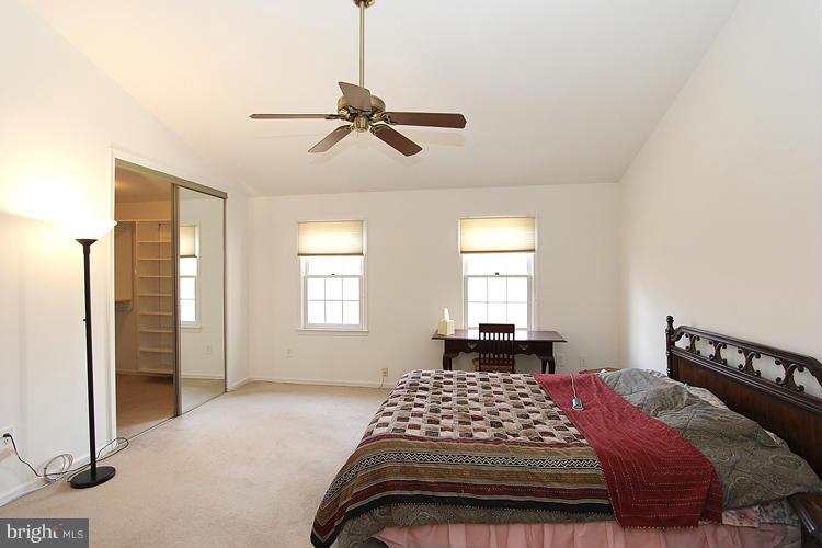 10922 Brewer House Road Rockville, MD 20852 - Photo 19 of 27 a bedroom with a bed and window