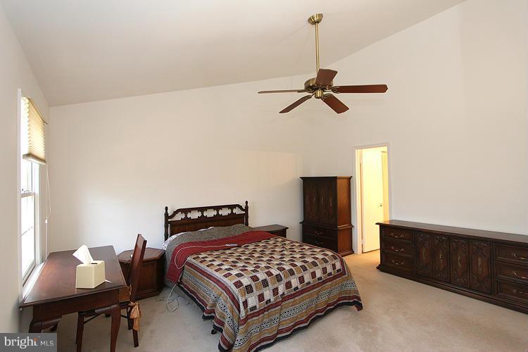10922 Brewer House Road Rockville, MD 20852 - Photo 20 of 27 a bedroom with a bed and dresser