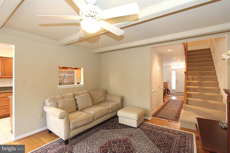 10922 Brewer House Road Rockville, MD 20852 - Photo 10 of 27 a living room with furniture and a rug