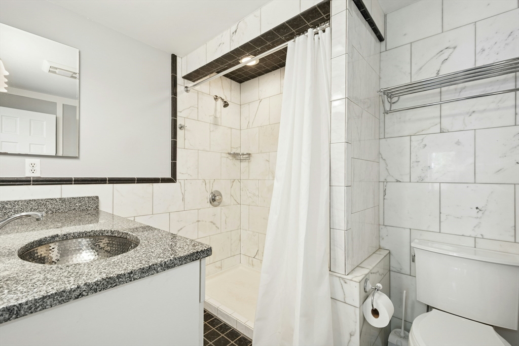 10 Erick Road, Unit 34 Mansfield, MA 02048 - Photo 14 of 24 a bathroom with a sink toilet and shower