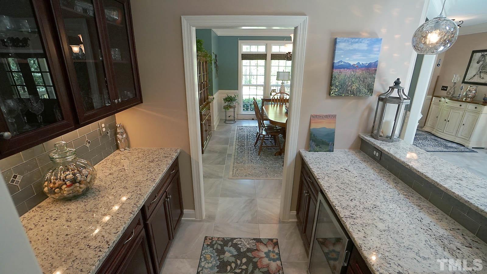 275 Hawfields Drive Pittsboro, NC 27312 - Photo 16 of 44 a living room with granite countertop furniture a fireplace and a flat screen tv