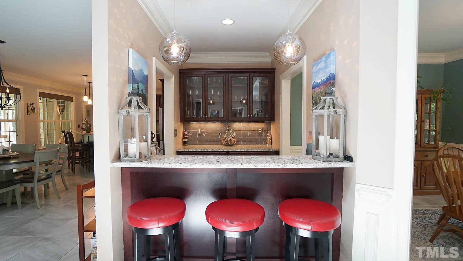 275 Hawfields Drive Pittsboro, NC 27312 - Photo 17 of 44 a kitchen with a table and chairs