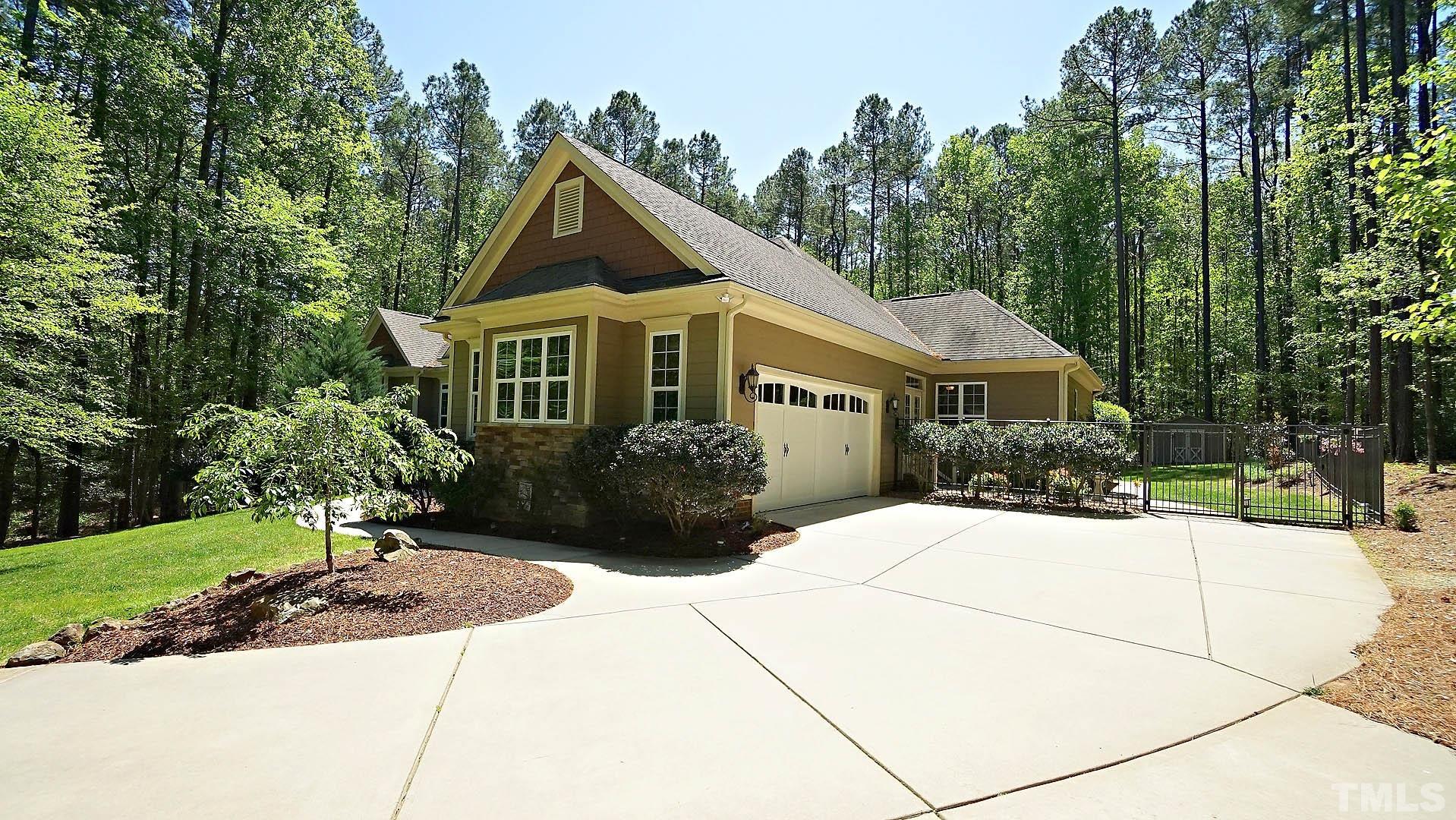 275 Hawfields Drive Pittsboro, NC 27312 - Photo 27 of 44 a front view of a house with a garden