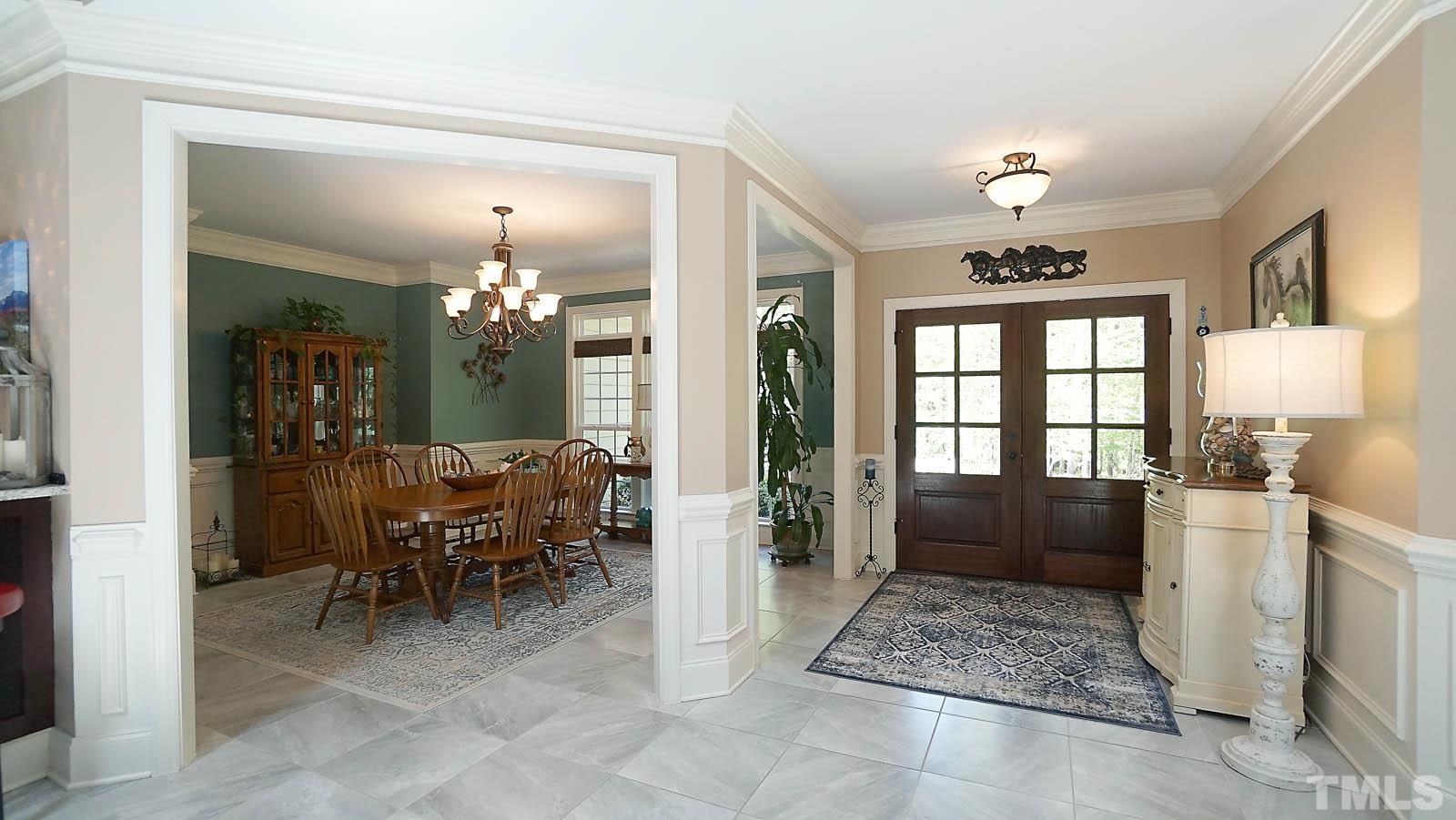 275 Hawfields Drive Pittsboro, NC 27312 - Photo 28 of 44 a view of a dining room with furniture window and wooden floor
