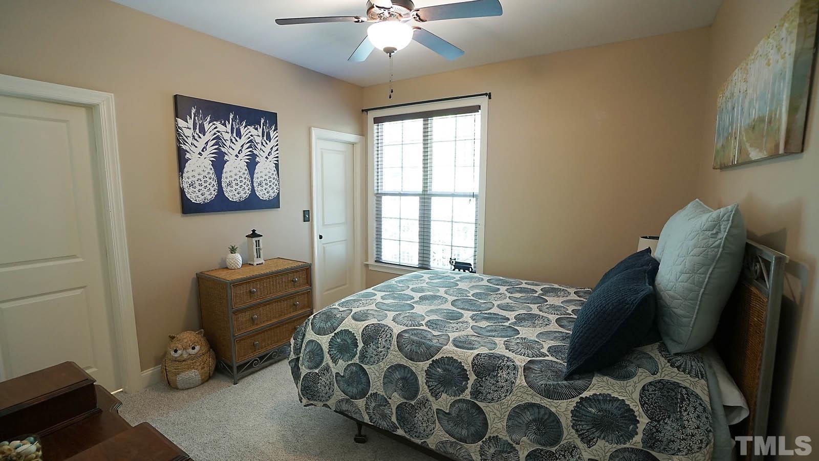275 Hawfields Drive Pittsboro, NC 27312 - Photo 32 of 44 a bedroom with a bed and a window