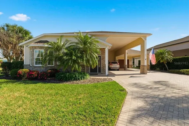 a view of a house with backyard and porch