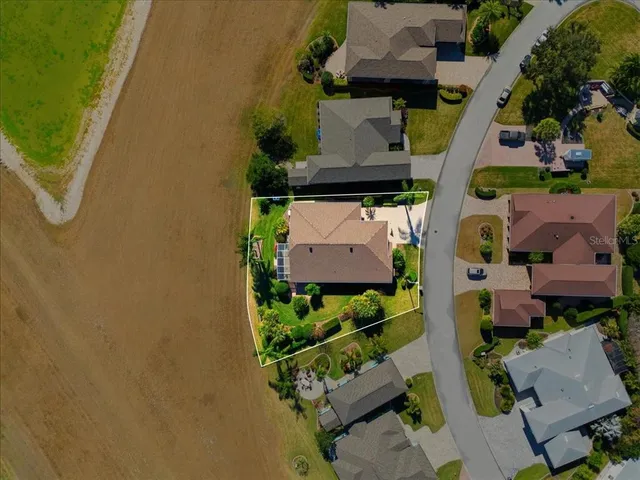 an aerial view of residential house with outdoor space