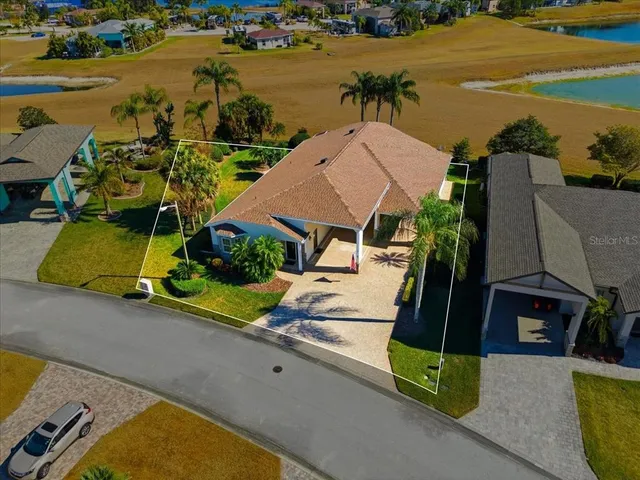 an aerial view of a house with a ocean view