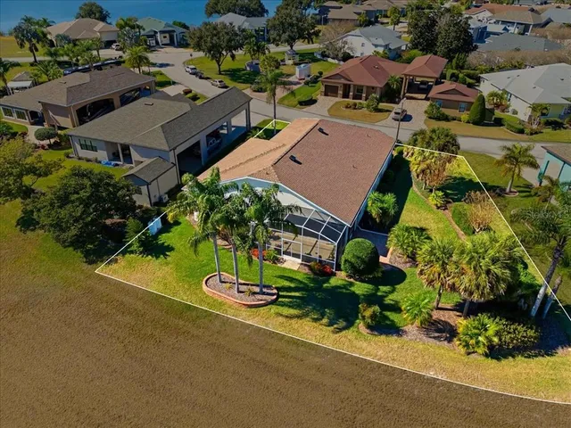 an aerial view of a house with a garden and plants