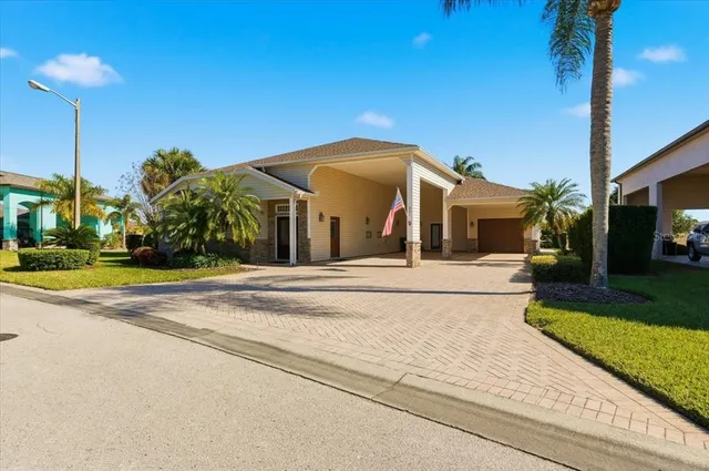 a view of a white house with a yard