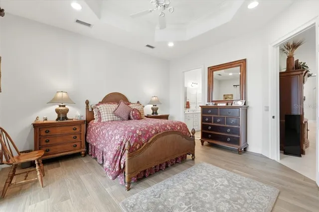 a spacious bathroom with a double vanity sink a mirror a bathtub and shower