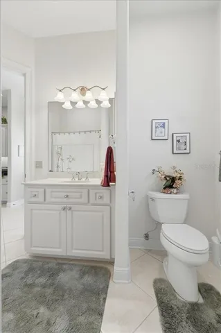 a view of a patio with table and chairs and potted plants