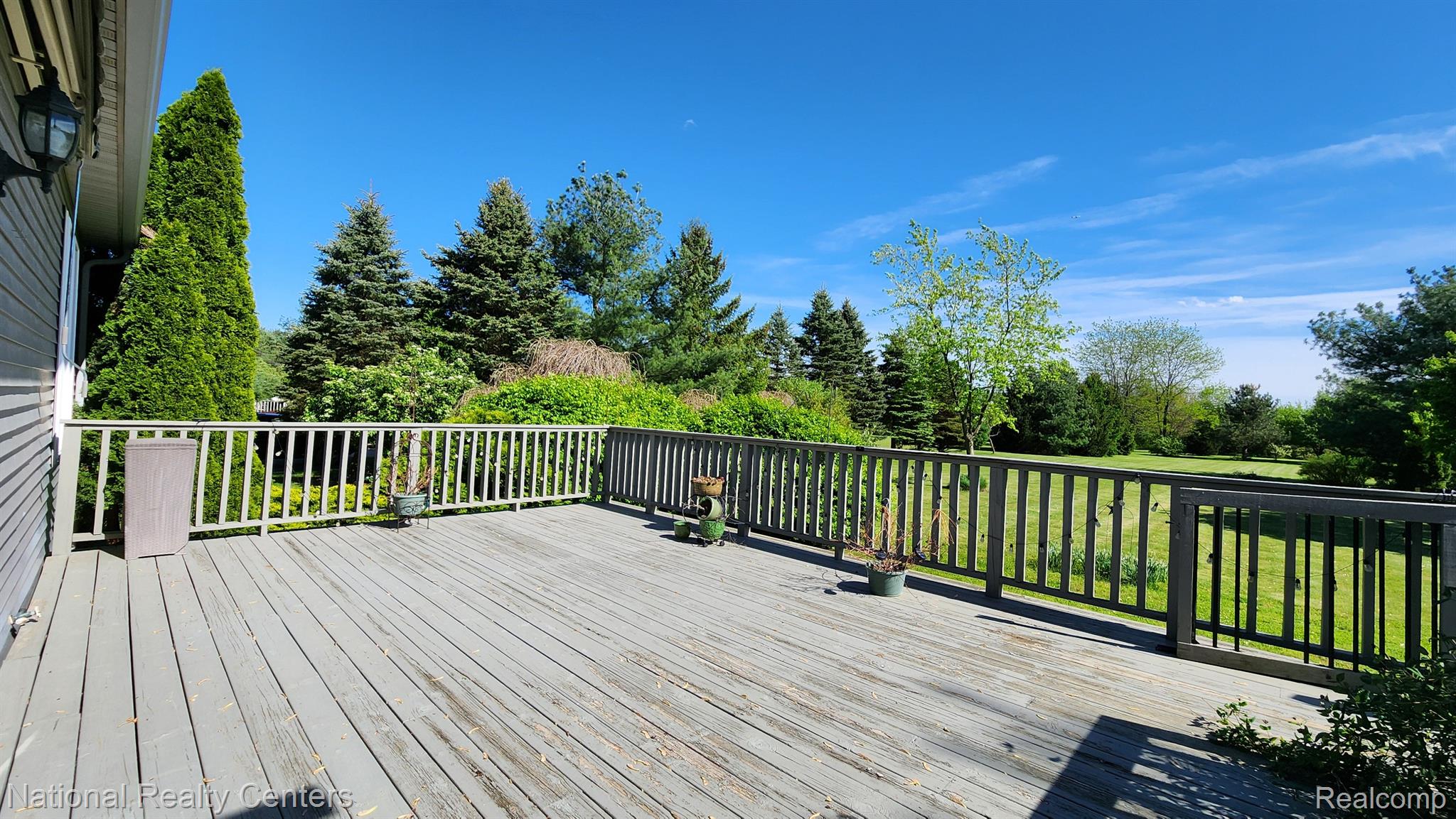 47745 Martz Road Belleville, MI 48111 - Photo 55 of 75 Huge deck off great room with retractable awning