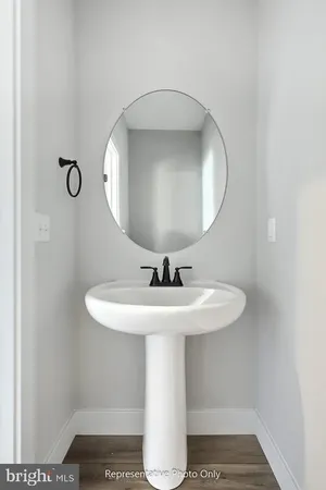 a bathroom with a sink and mirror