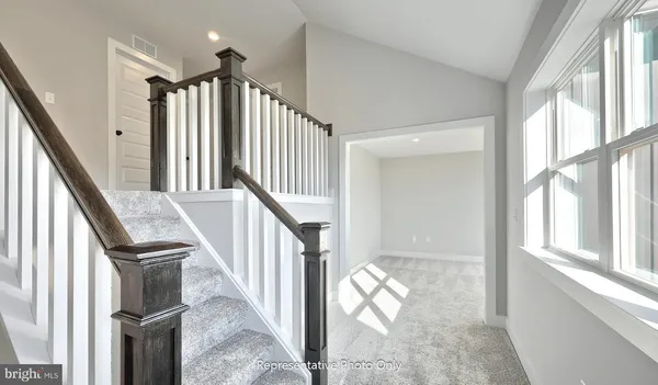 a view of staircase with lots of windows