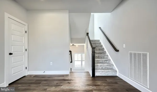 a view of entryway with wooden floor