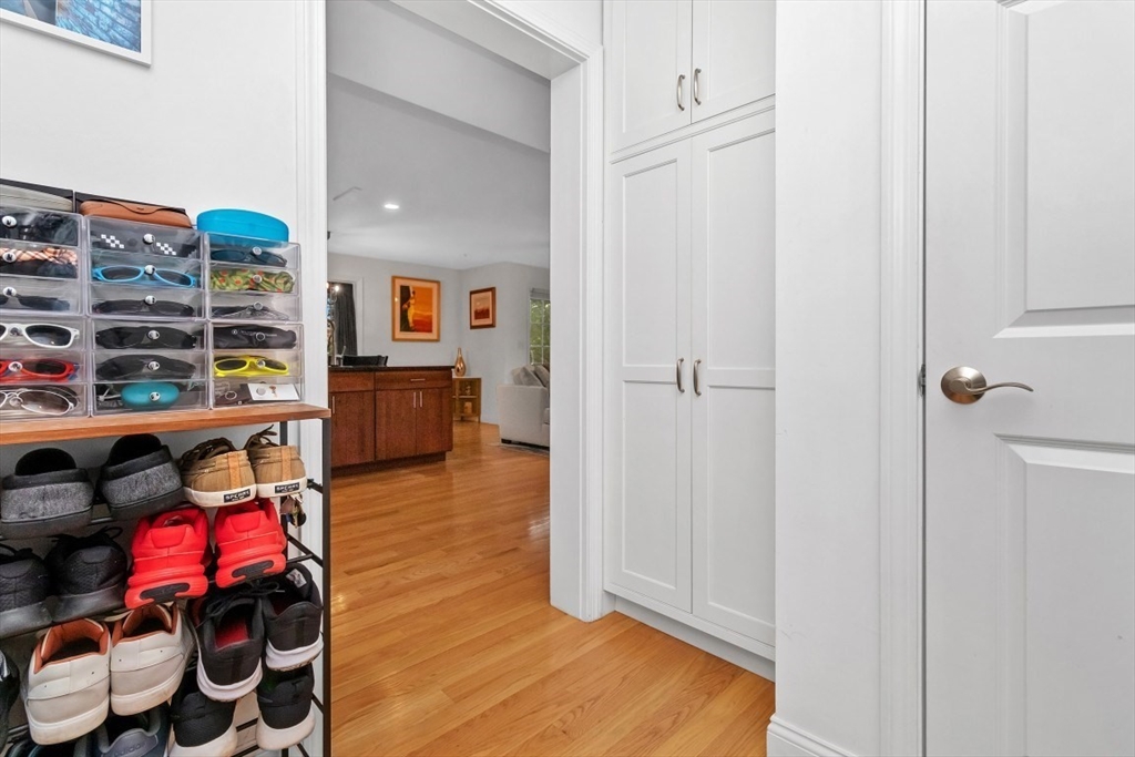 29 Spruce Street, Unit 23 Waltham, MA 02453 - Photo 21 of 26 a living room with furniture and a wooden floor