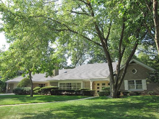 176 Scottswood Road Riverside, IL 60546 - Photo 1 of 1 a front view of a house with a garden