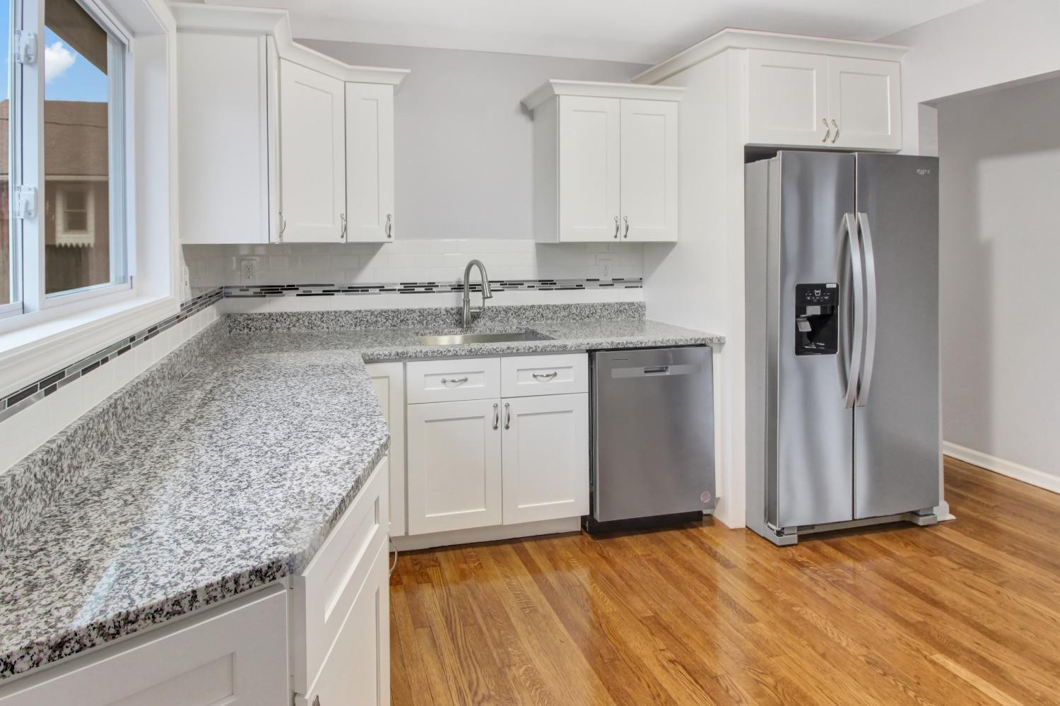 905 East Ridge Road Gary, IN 46409 - Photo 6 of 15 a kitchen with stainless steel appliances granite countertop a sink stove and refrigerator