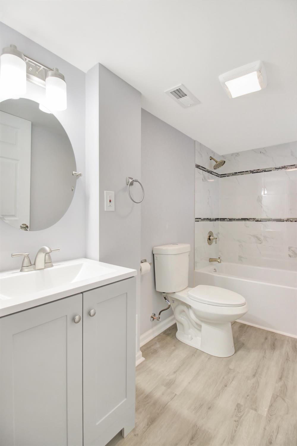 905 East Ridge Road Gary, IN 46409 - Photo 10 of 15 a bathroom with a sink a toilet and a mirror